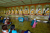 Myanmar - Sagaing hill, Umin Thounzeh (the 30 Caves), a colourful crescent-shaped colonnade within which there are 45 Buddha images. 